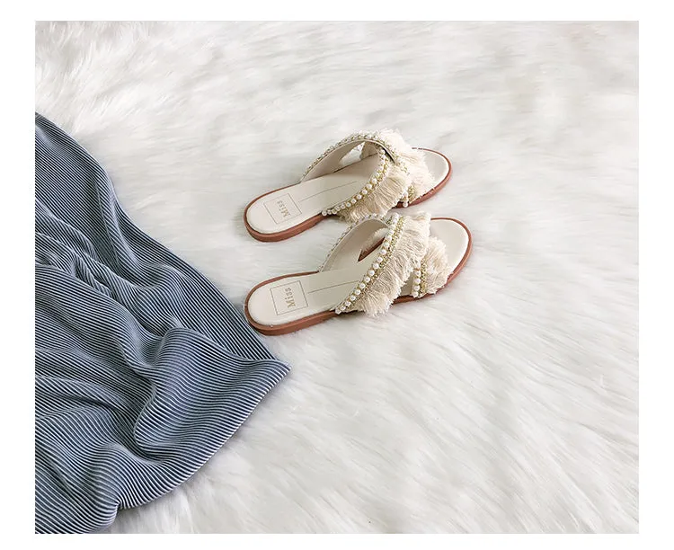 BOOPDO DESIGN CROSS OVER FLAT SANDALS WITH TASSEL AND PEARL DETAIL