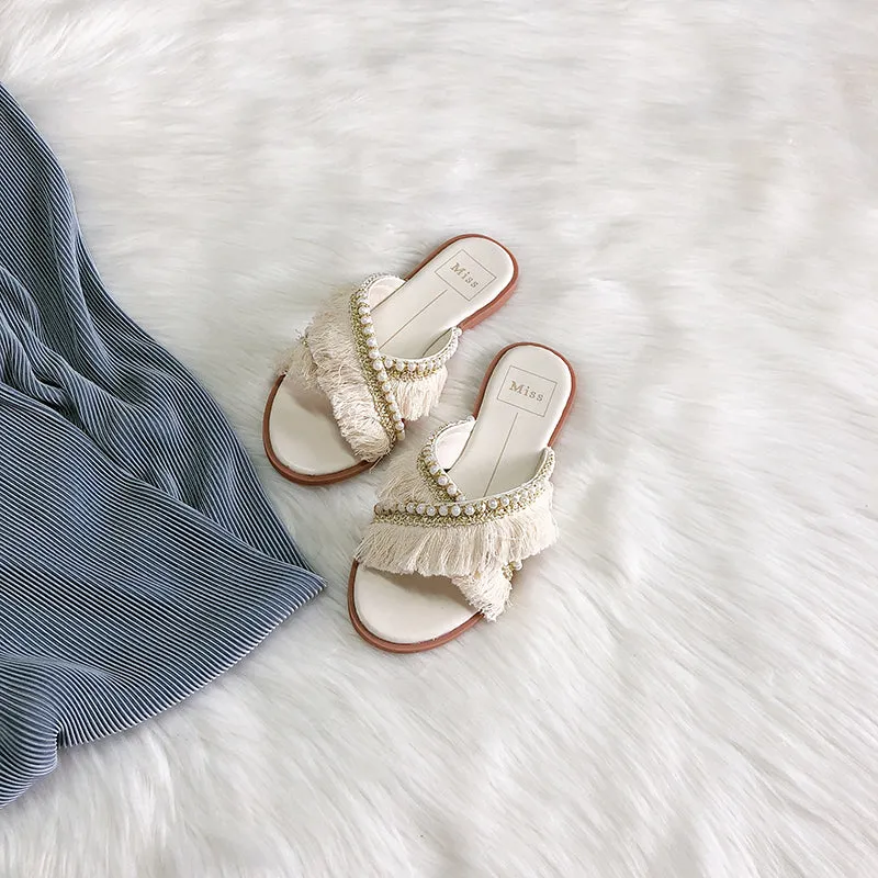 BOOPDO DESIGN CROSS OVER FLAT SANDALS WITH TASSEL AND PEARL DETAIL
